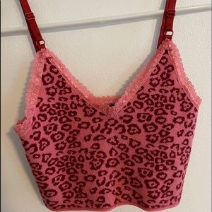 Pink cheetah print knit crop top with lace detail